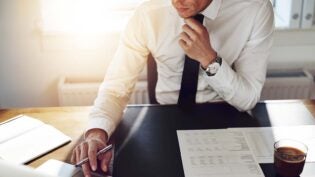 businessman seated at desk