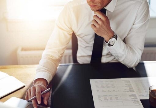 businessman seated at desk