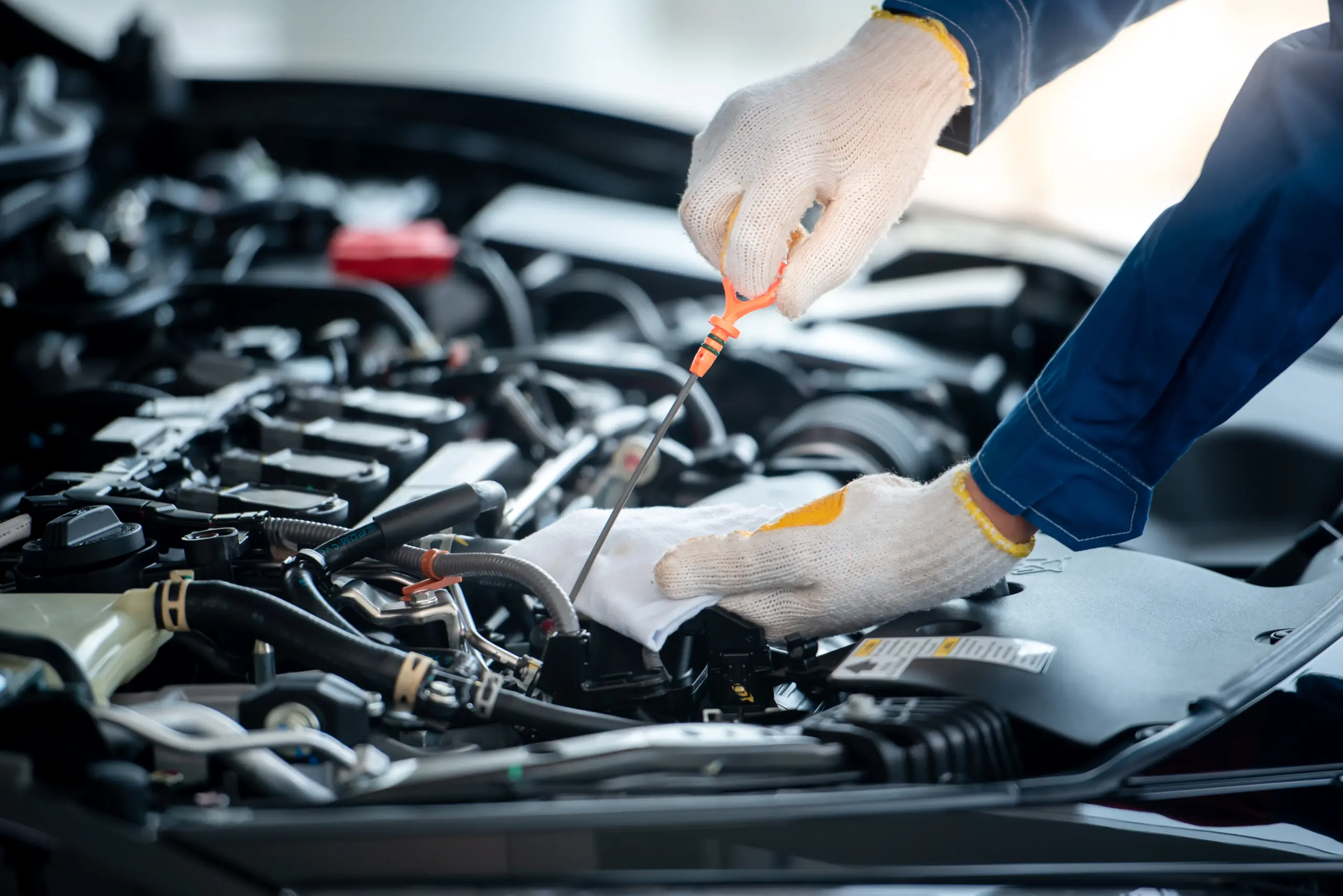 Engine inspection on a company or personal vehicle in a garage.