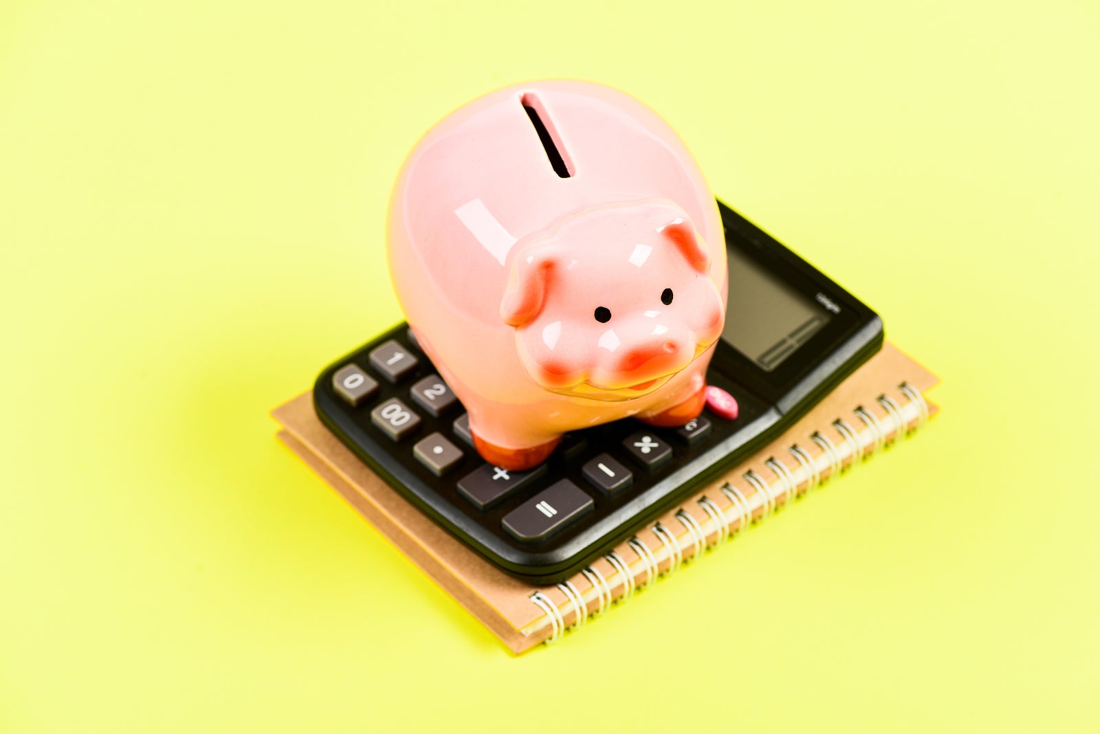 Taxes calculator. Accounting business. Piggy bank symbol money savings. Investments concept. Piggy bank pig and calculator. Taxes and charges may vary. Helping make smart financial choices. Pay taxes