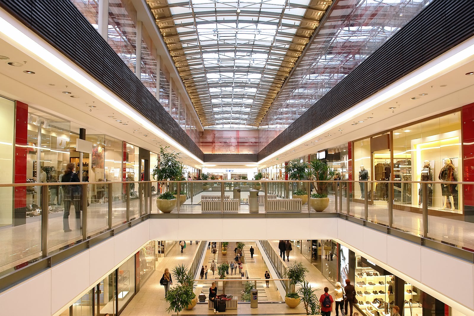 passage in a multilevel shopping mall with shoppers