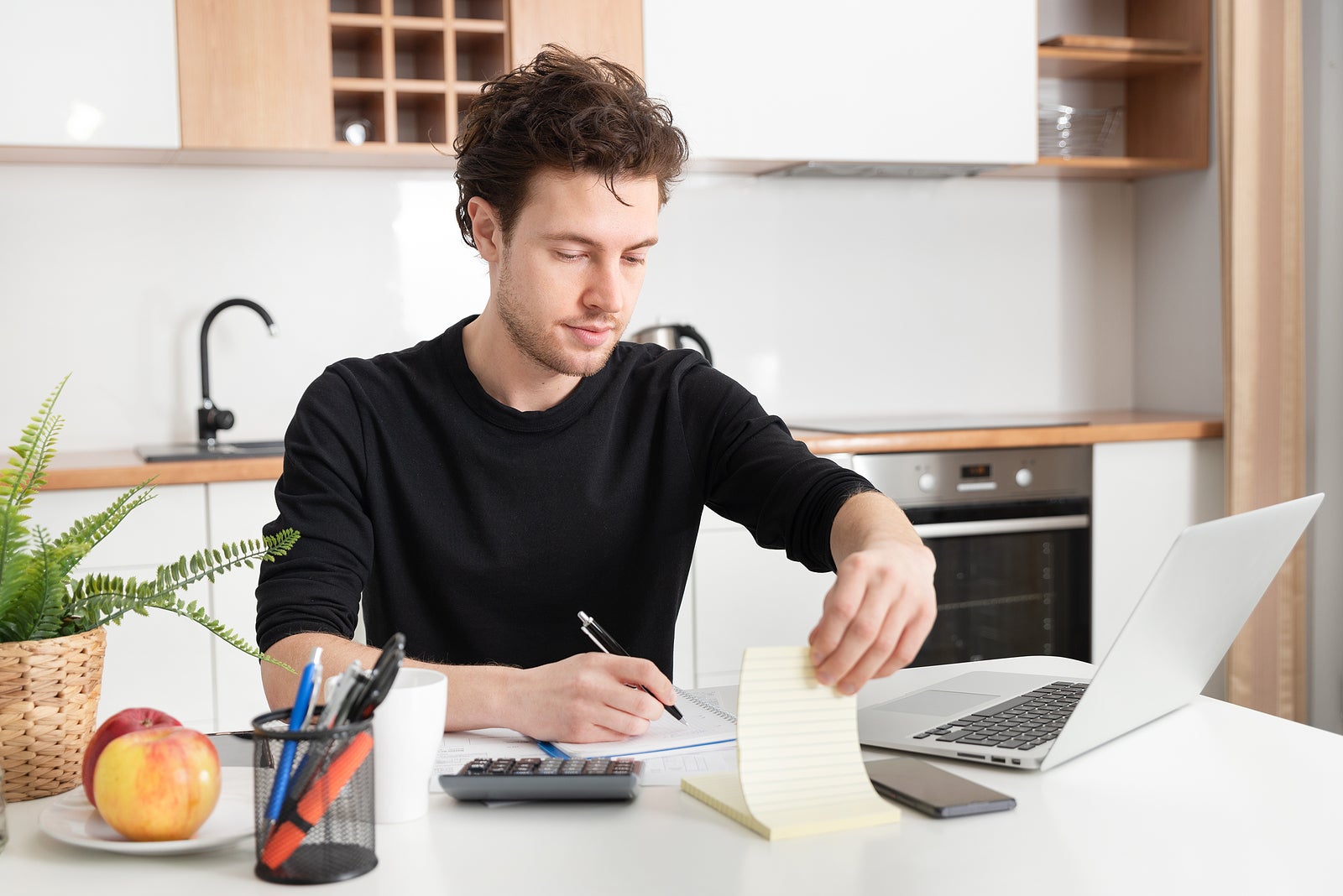 Young man working at home. Home office, remotely working concept