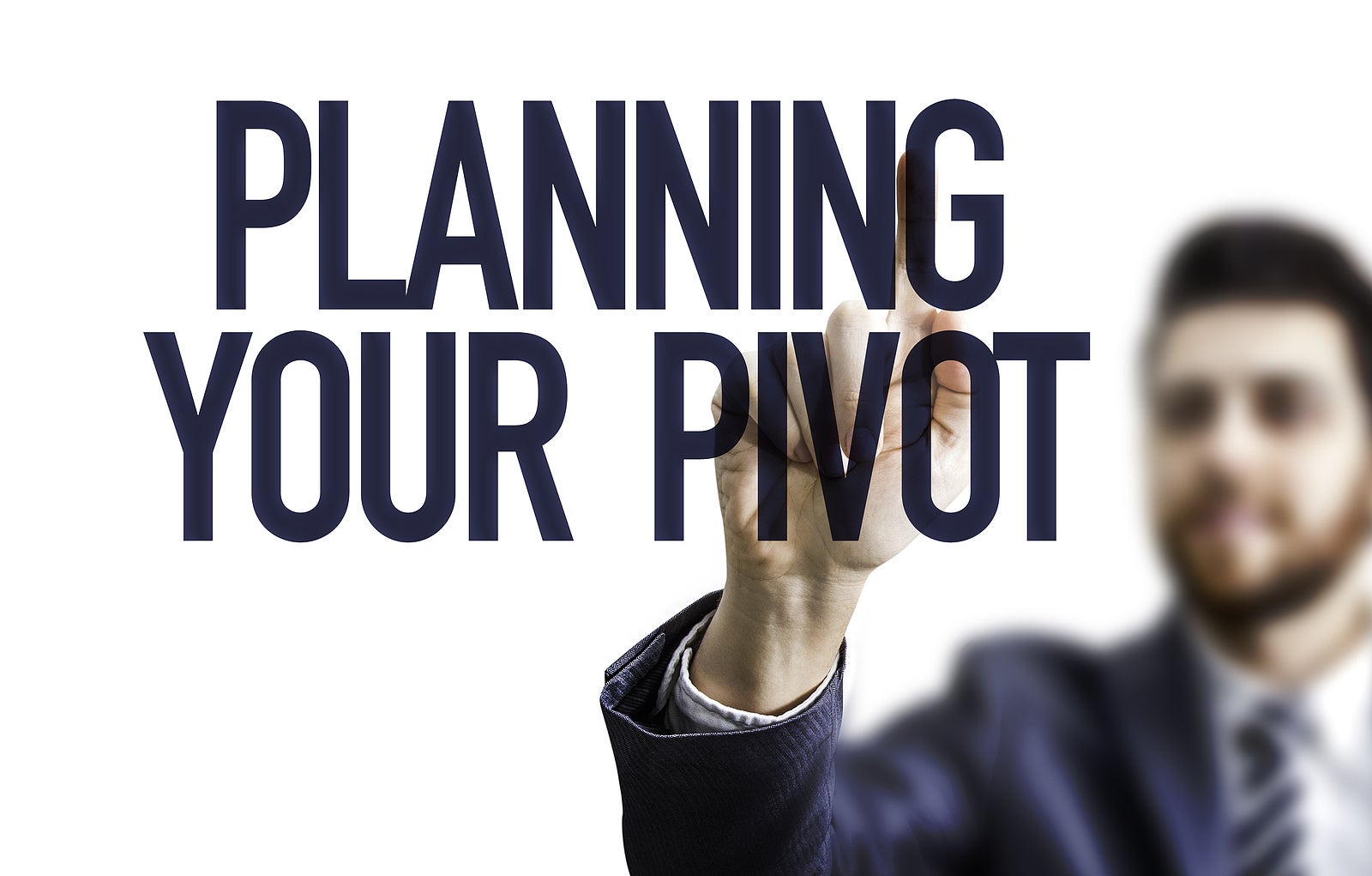Business man pointing the text: Planning Your Pivot