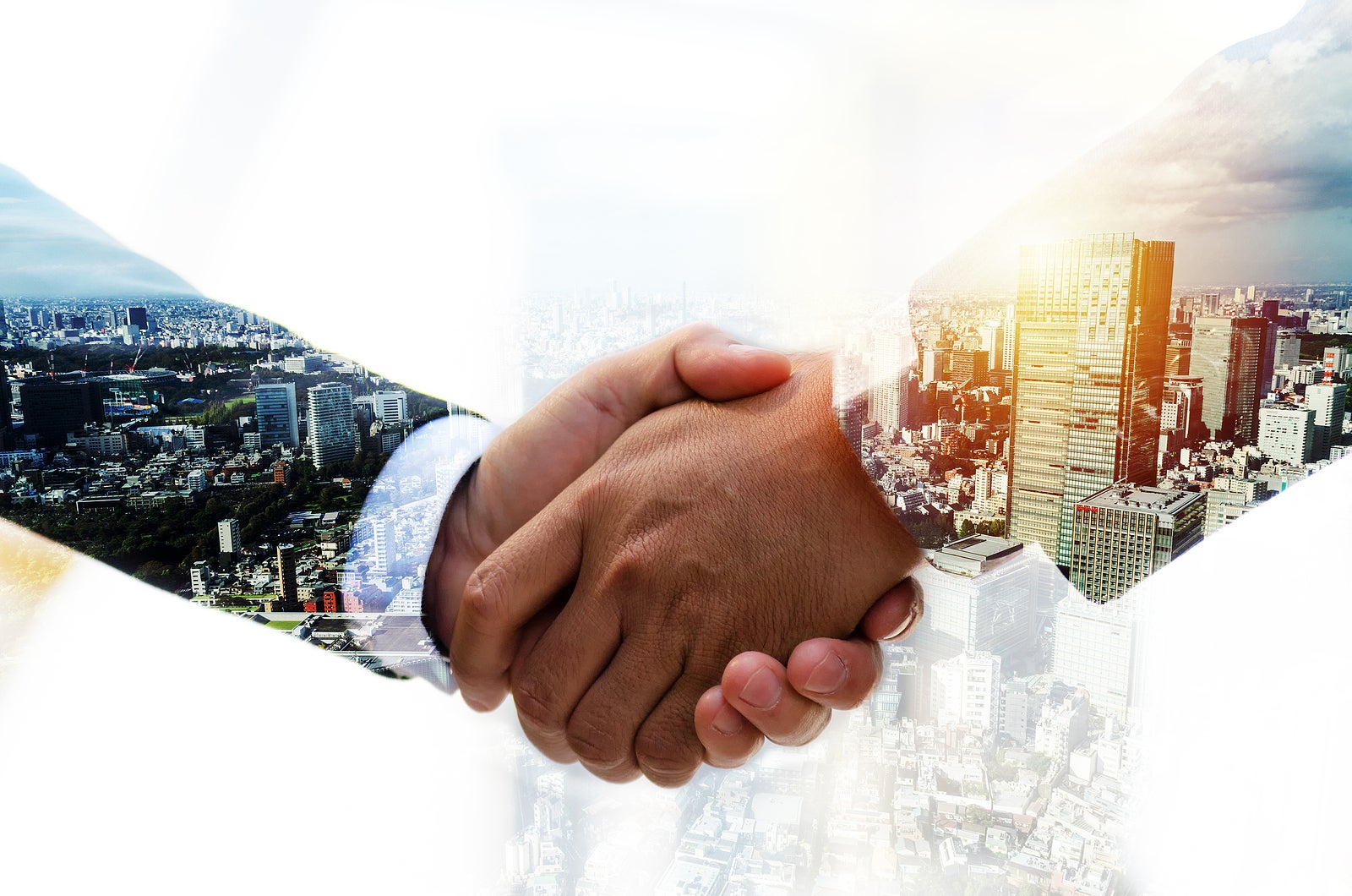 Partnership. double exposure image of investor business man handshake with partner for successful meeting deal with during sunrise and cityscape background, investment, partnership, teamwork concept