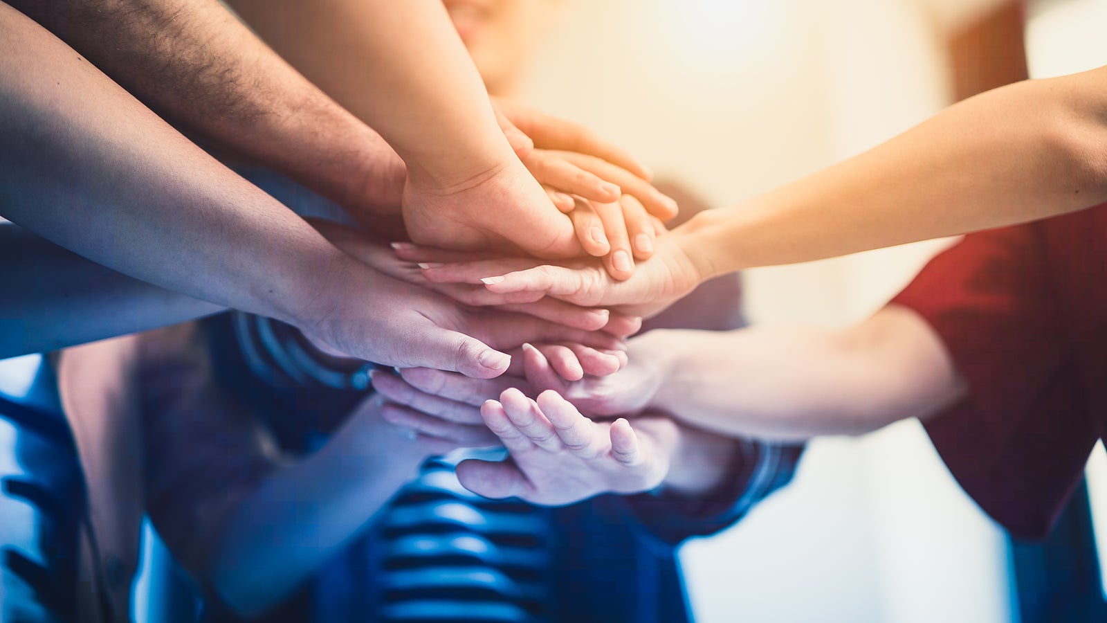 Stack of hand from volunteering of people to show  teamwork spirit togetherness, Concept of young generation diversity to create achievement in the future, Volunteer of people for social sacrifice.