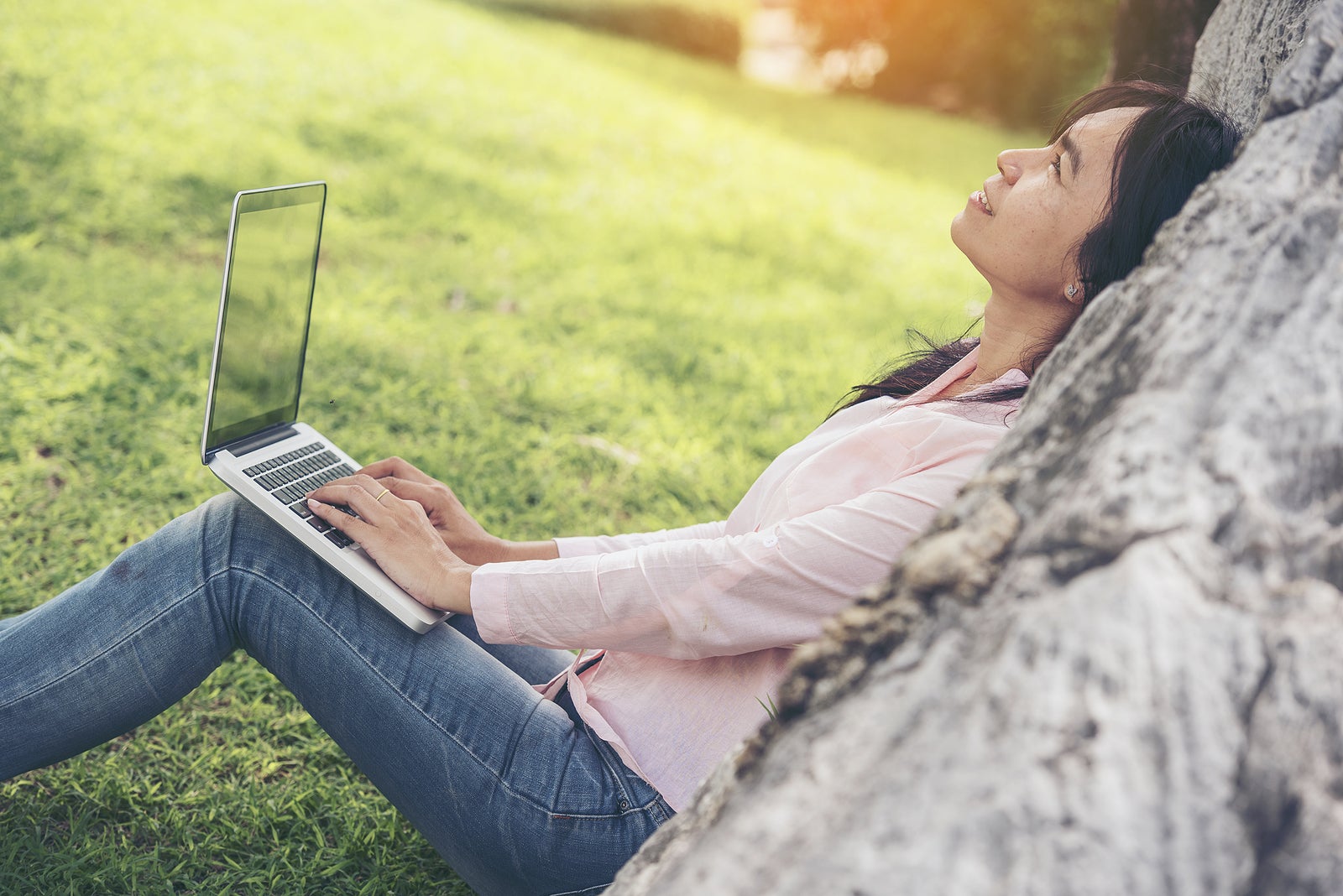 Work from home banner woman working on laptop outdoor at home cause of corona covid-19 virus world pandemic infection. Beautiful women connect internet outdoor working wireless internet technology