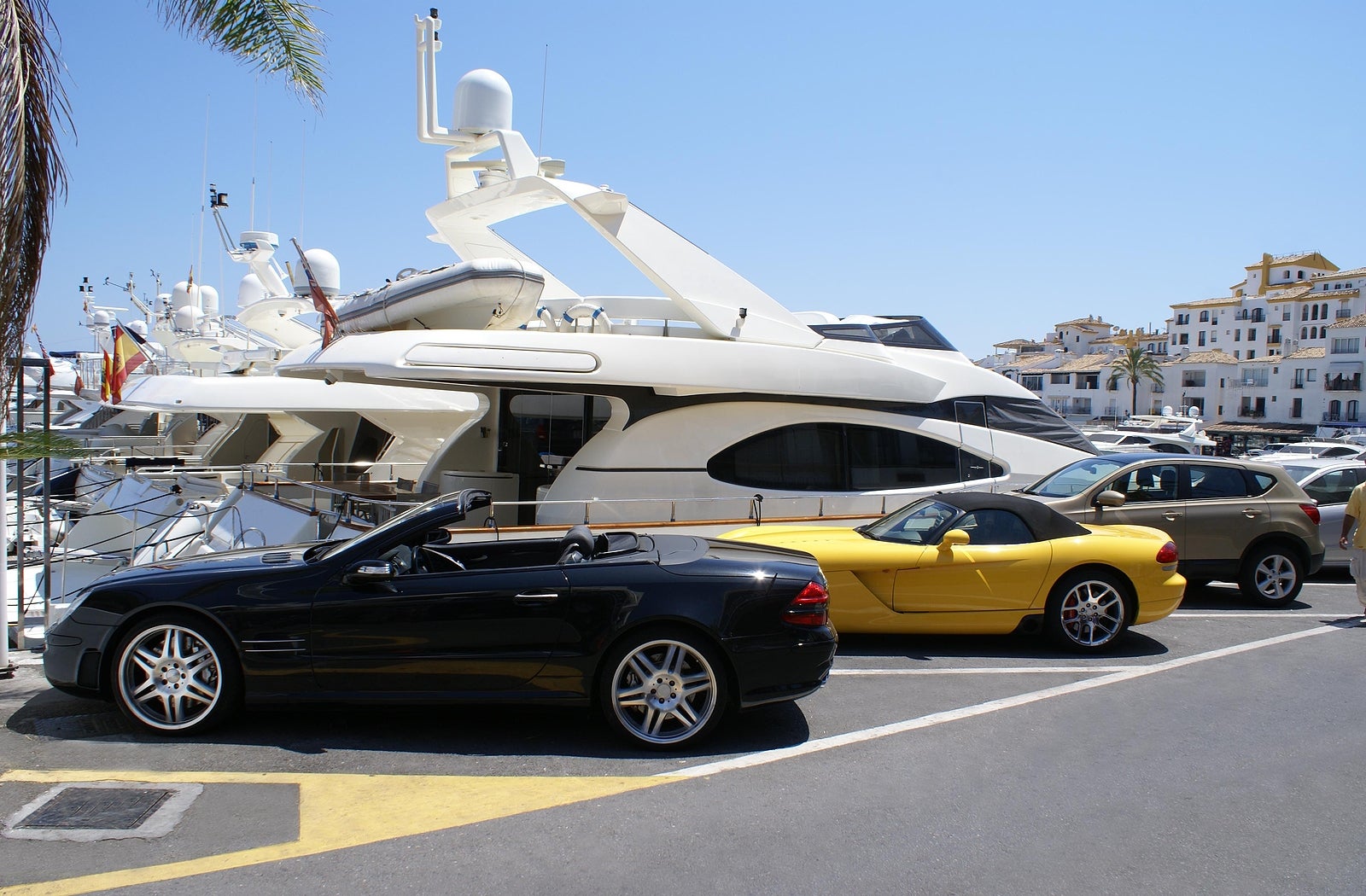 Luxury cars in the car park of the yacht club of Marbella Spain. Marbella is the luxurious area of the celebrities