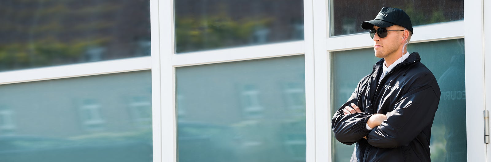 Security Guard Agent Standing At Door Entrance