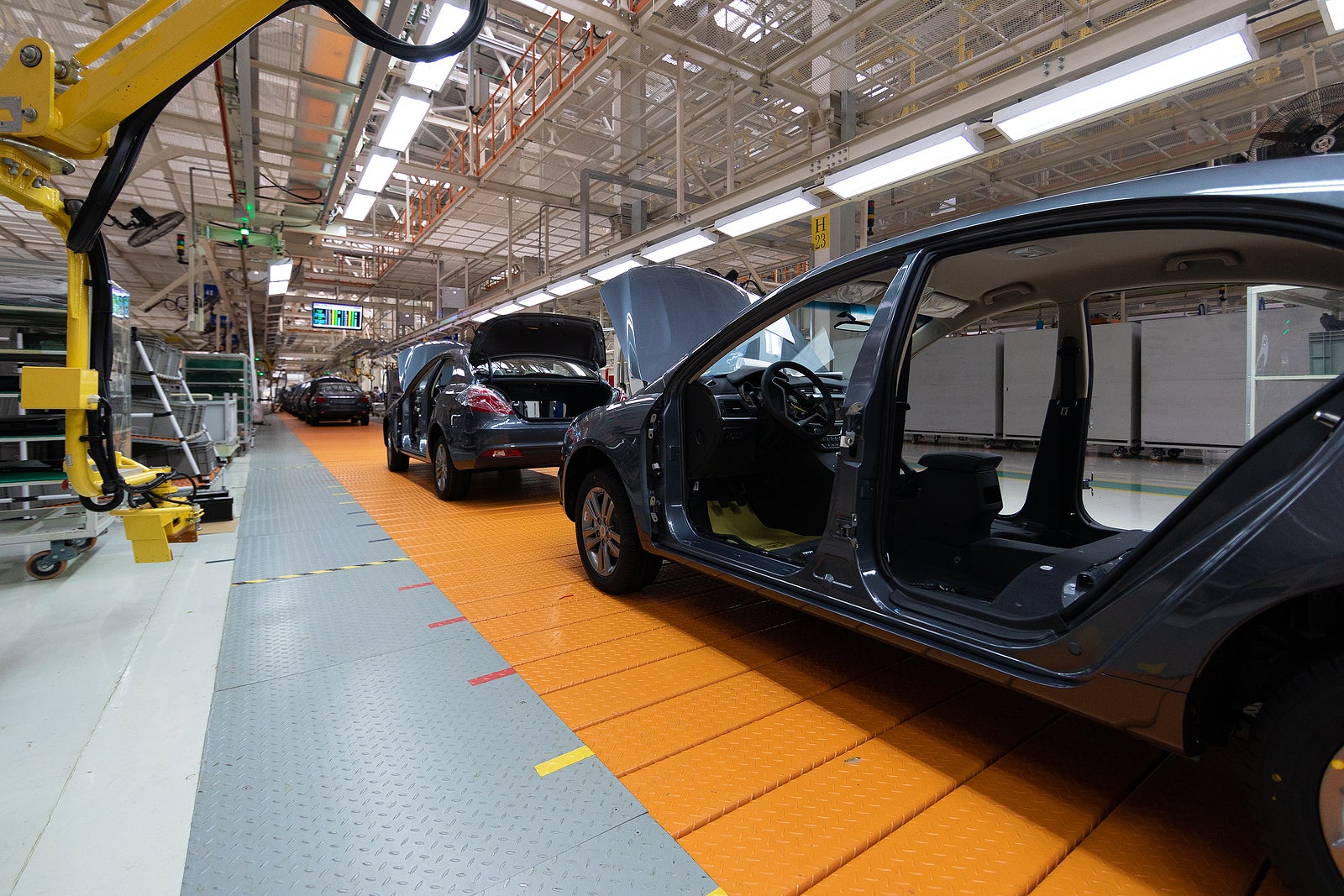 Assembled car is on the Assembly line. Robotic equipment makes the Assembly of the car. Modern car Assembly at the factory