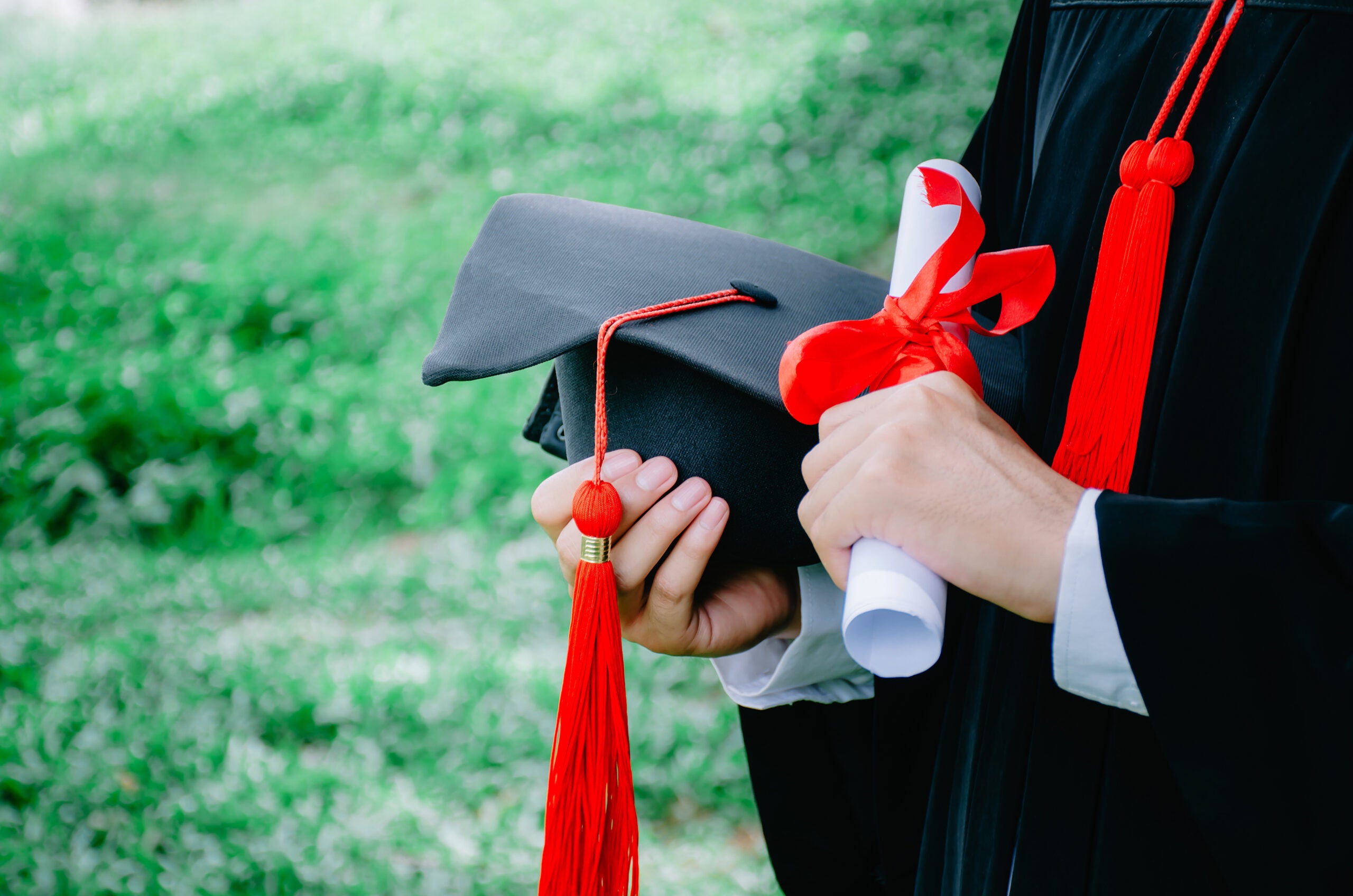 Graduation,Student hold hats and diploma in hand during commencement success graduates of the university,Concept education congratulation,Graduation Ceremony,Isolated on white background