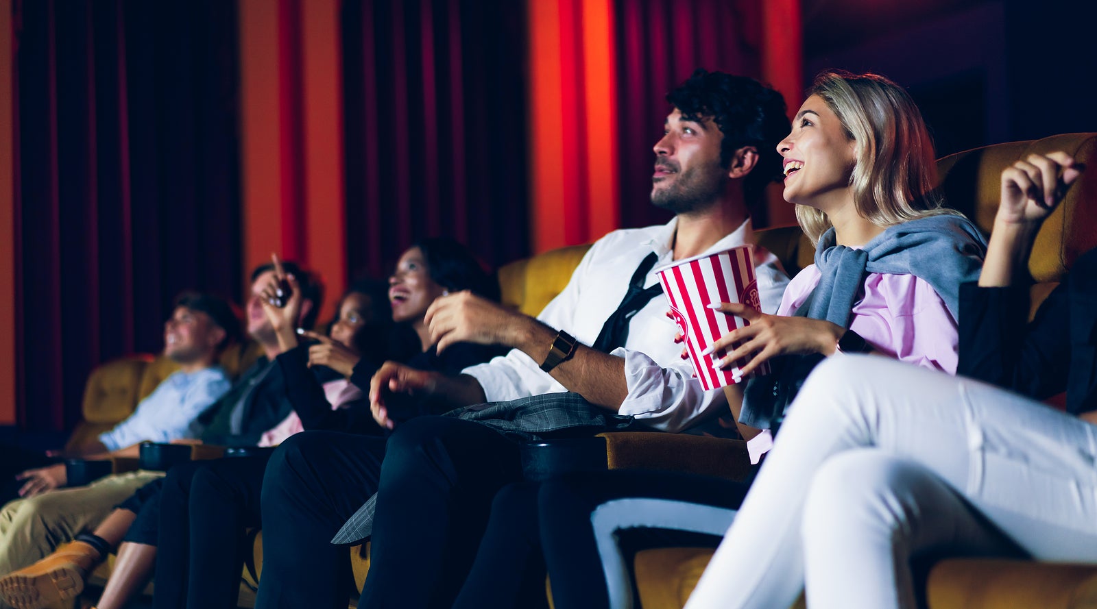 Group of audience happy and fun watch cinema in movie theater. Group recreation activity and entertainment concept.