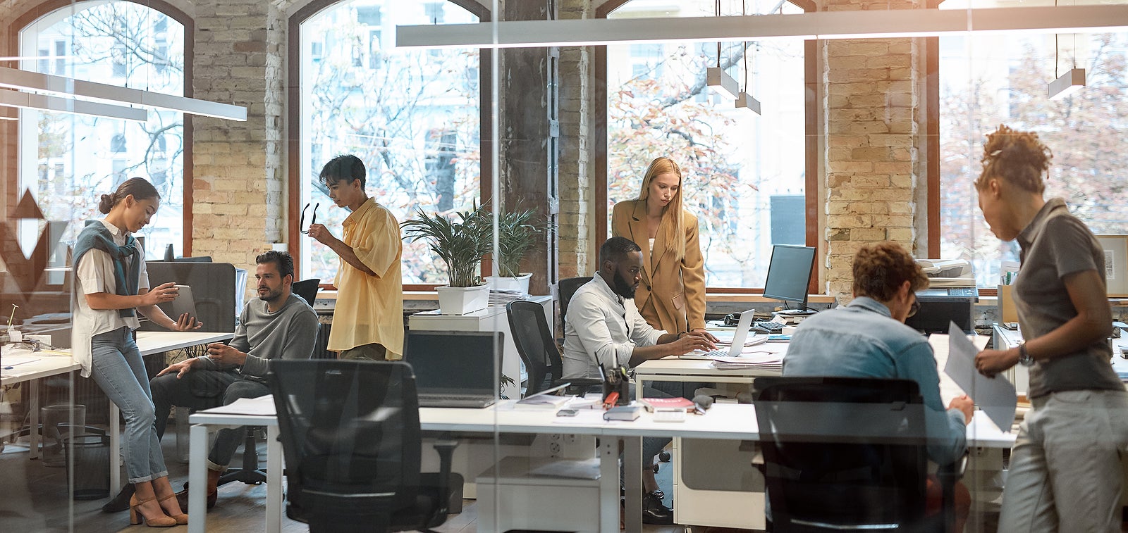 Group of young mixed race business people working together in the creative office. Team building concept. Office life. Cooperation