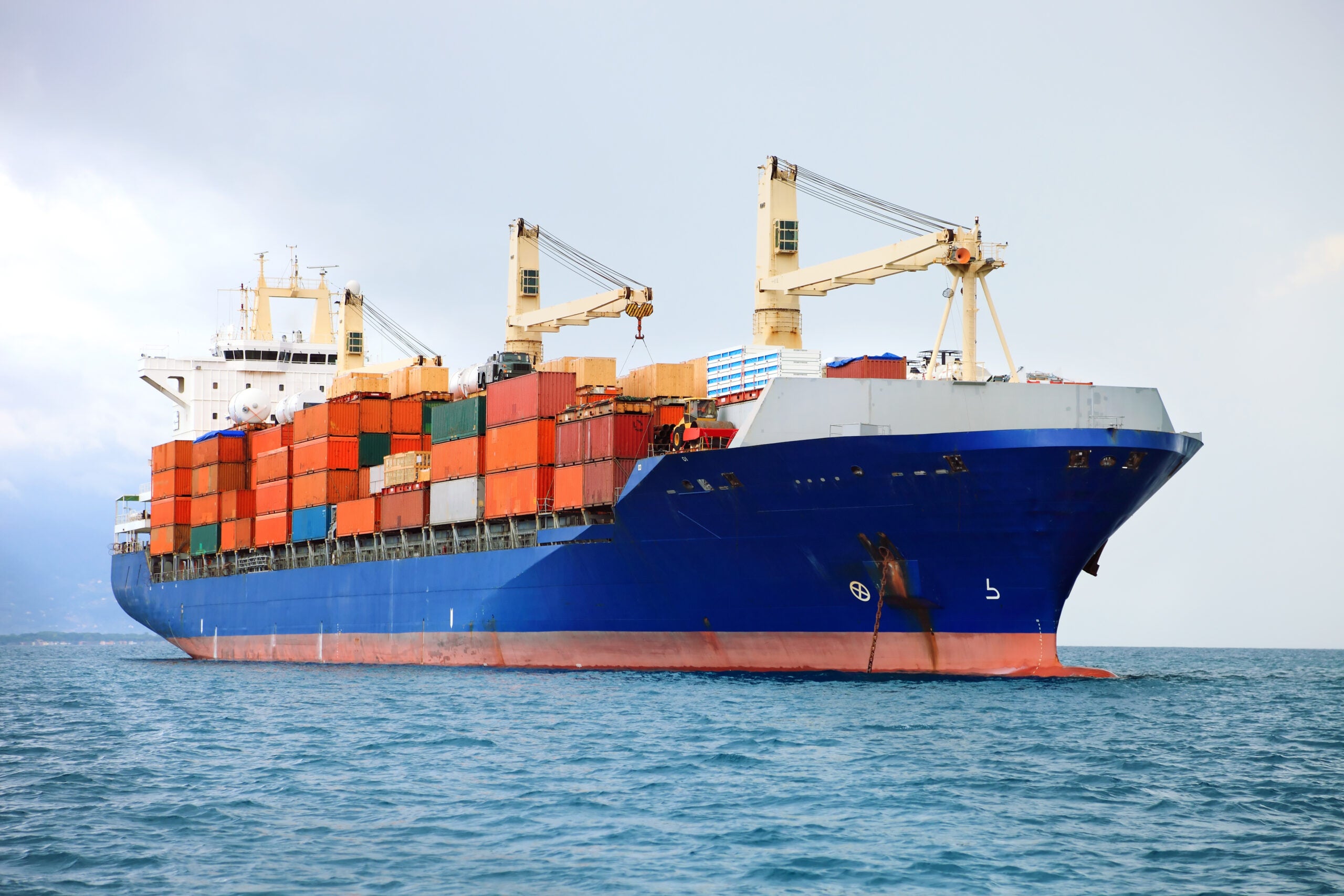 cargo container ship in mediterranean coast