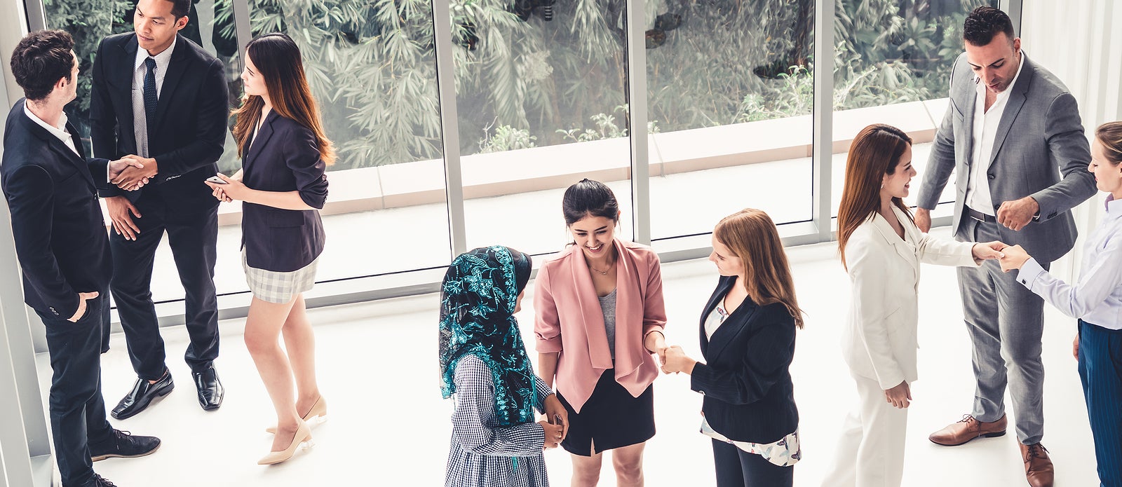 Many business people gathering in modern office building for business conference in the city. Businessmen and businesswomen communication and human resources concept.