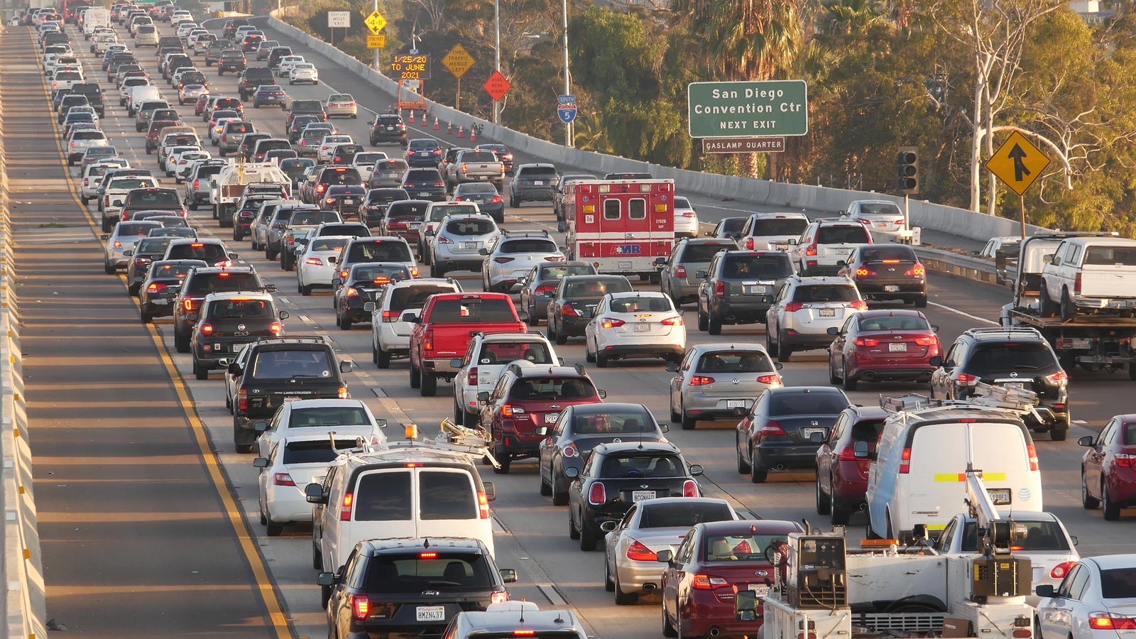 SAN DIEGO, CALIFORNIA USA - 15 JAN 2020: Emergency 911 auto on busy intercity freeway. Paramedic car in traffic jam on highway during rush hour. Transportation concept and transport in metropolis