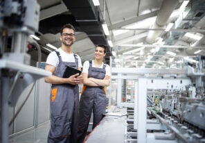 two workers at a production line