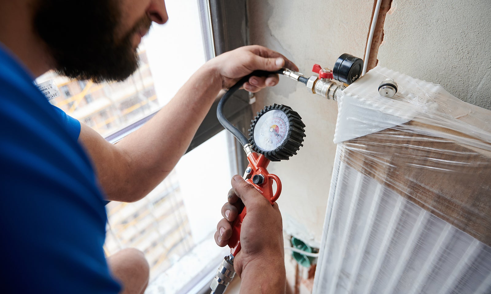 a plumber working in an apartment