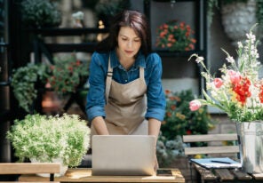 a small business owner working at her floral shop