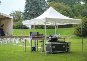 a pop up tent protecting an event's audio equipment