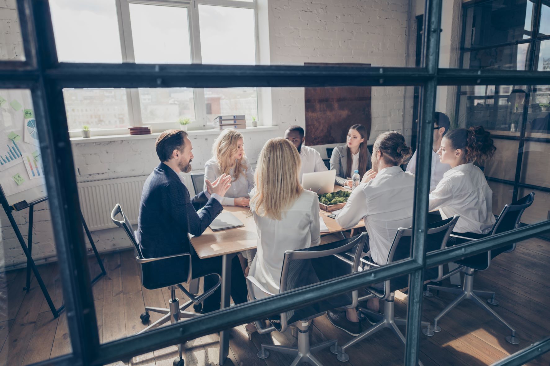 a sales team meeting with the business leader