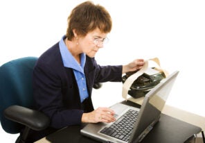 a stenographer reviewing a transcript