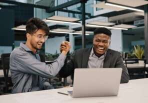 two employees celebrating their mutual success