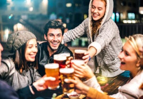 a group of people enjoying beers outside