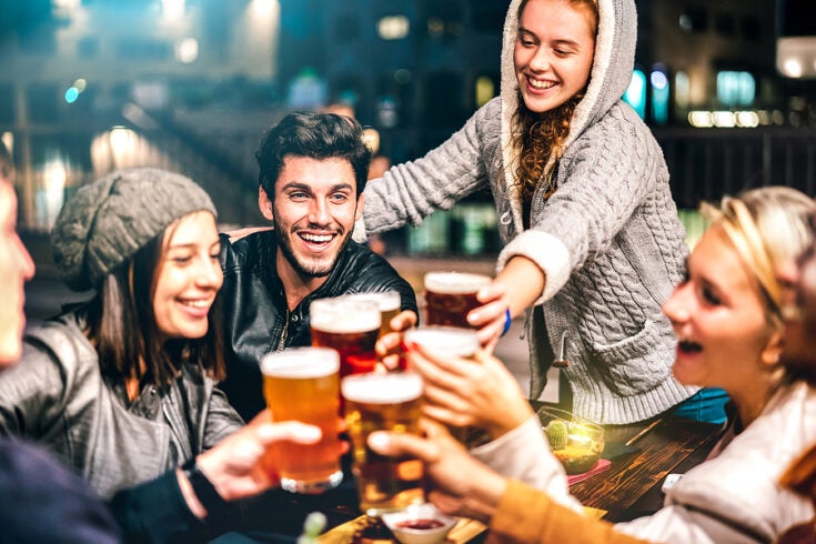 a group of people enjoying beers outside