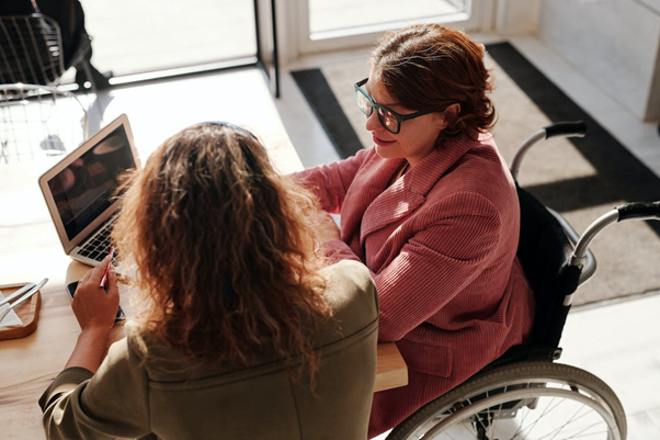 a woman speaking with her lawyer