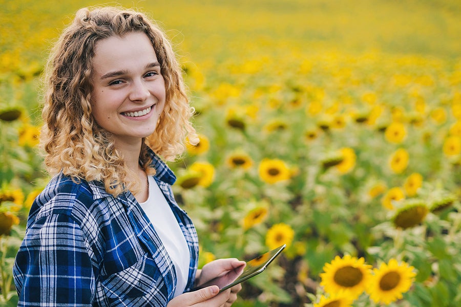 an agricultural entrepreneur happy and smiling