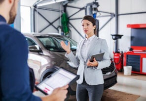 a business person frustrated with a mechanic's price quote