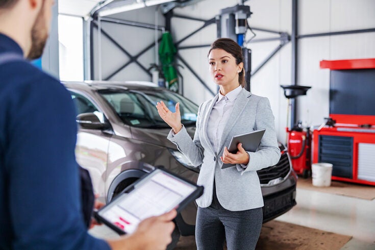 a business person frustrated with a mechanic's price quote