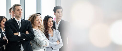 a proud business team standing together