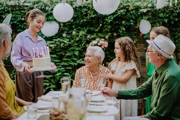 a multi generational family celebrating a birthday