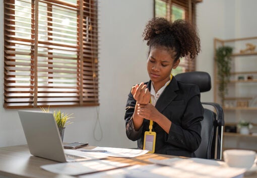 an employee tending to a wrist injury