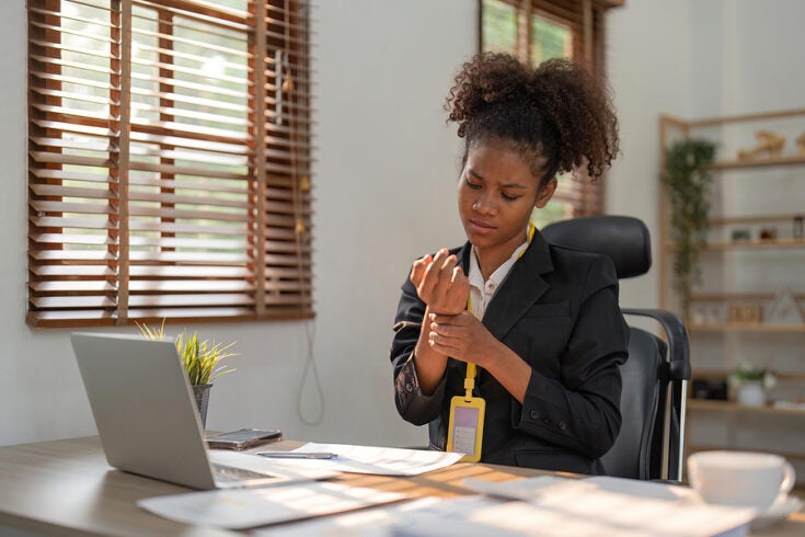 an employee tending to a wrist injury