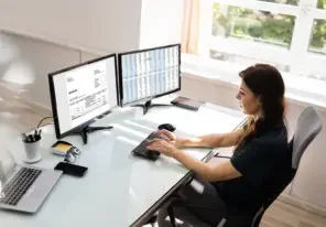 a woman using invoice application software