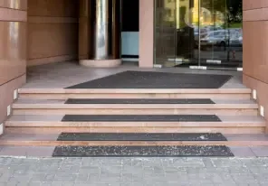 stairs leading to a business protecting against accidental slips
