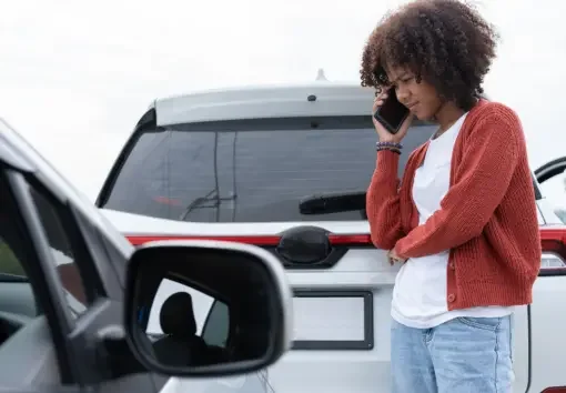 a woman taking the necessary steps after a car accident