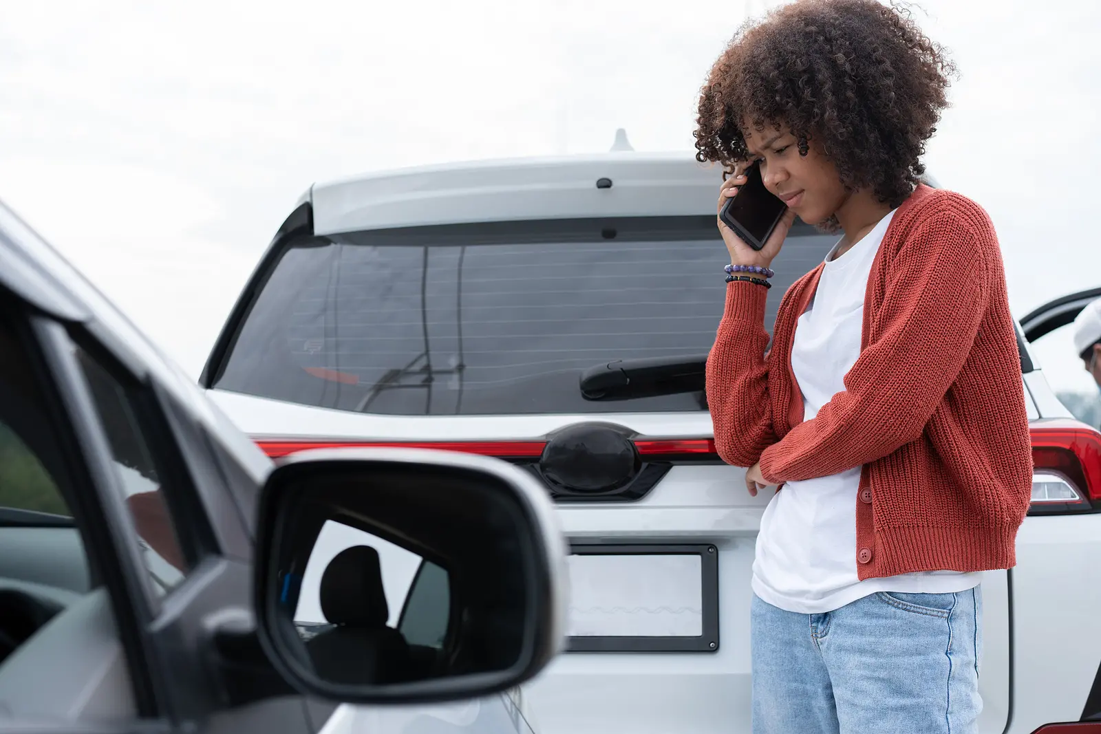 a woman taking the necessary steps after a car accident