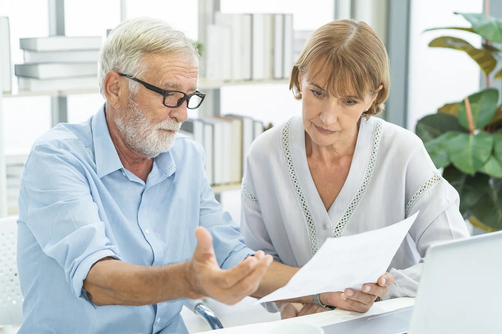 an older man and woman planning for retirement