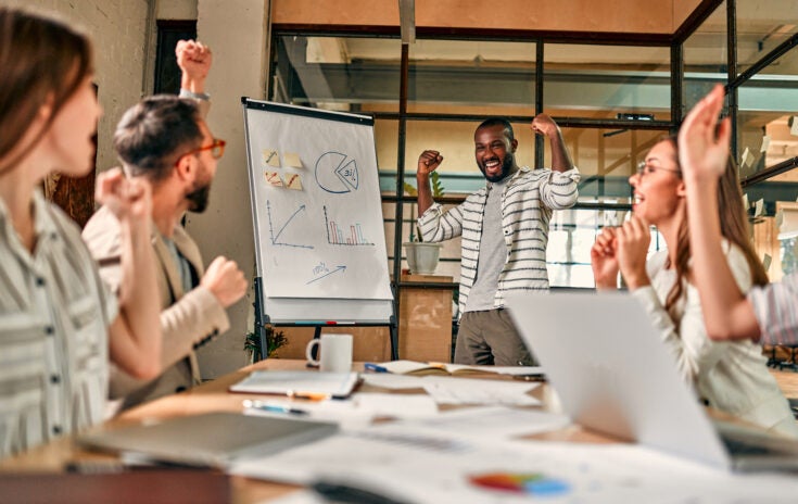 a business owner having a successful meeting with their team