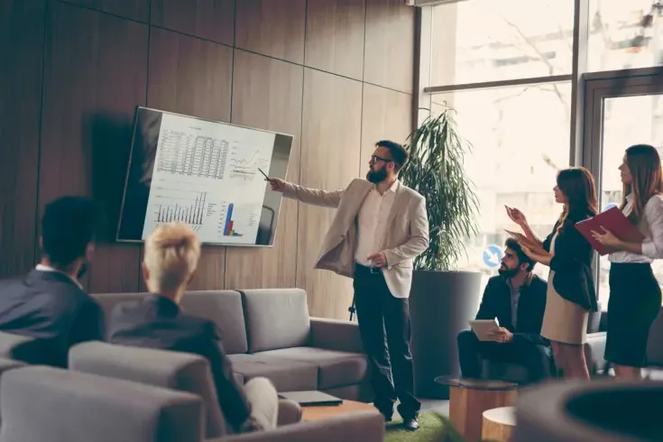 a business person giving. a presentation to their team