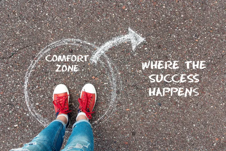 a photo implying success happens when you step outside your comfort zone