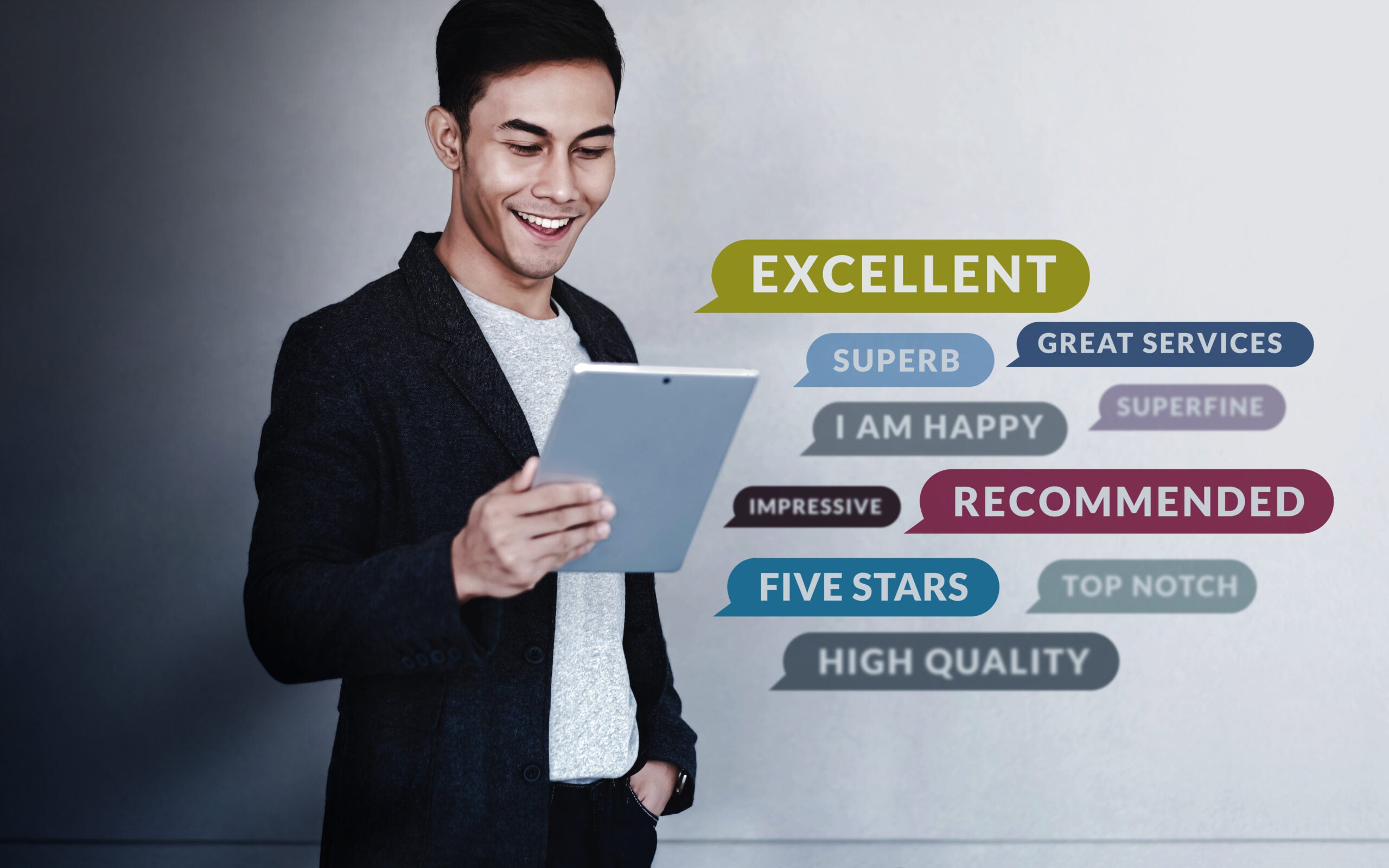 Customer Experiences Concept. a Young Happy Man Reading Positive Review Rating via Digital Tablet. Client's Satisfaction Surveys Online