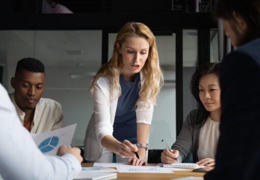 a team of business people reviewing market research