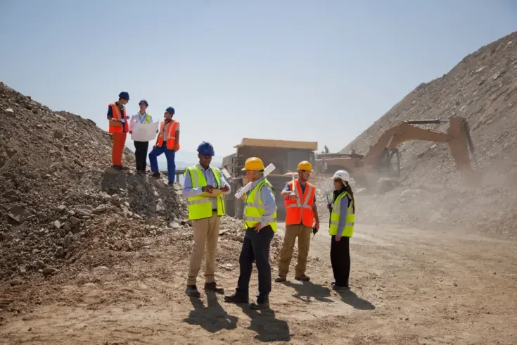 a group of construction workers and managers on site