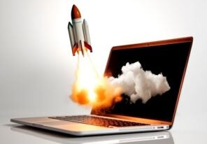a stylized photo of a rocket ship blasting off through a computer screen