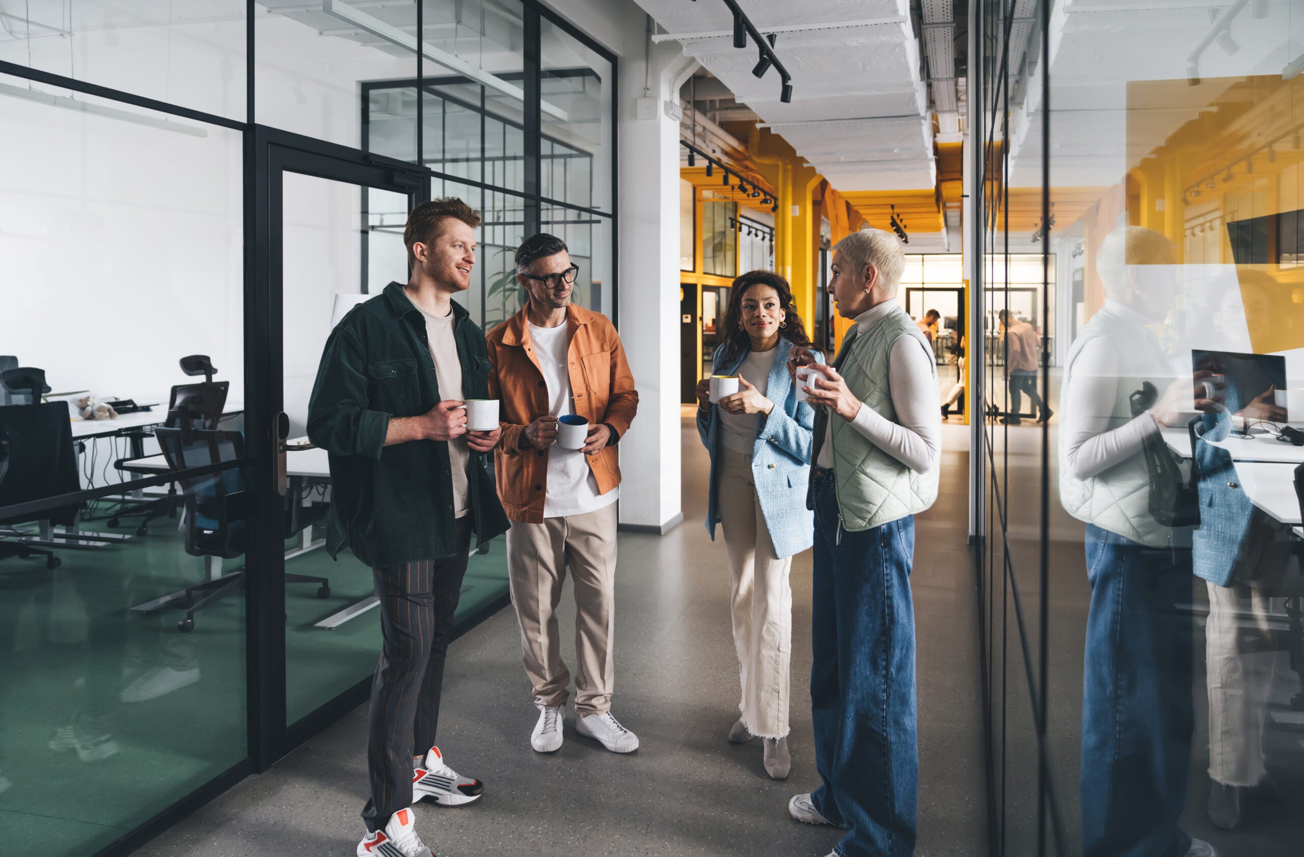 a group of colleagues using their break time to have a conversation