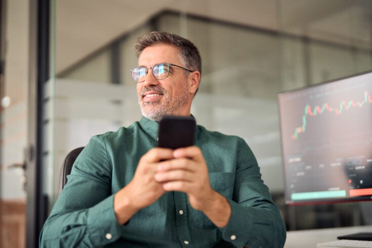 a person smiling implying they have invested in an AI company